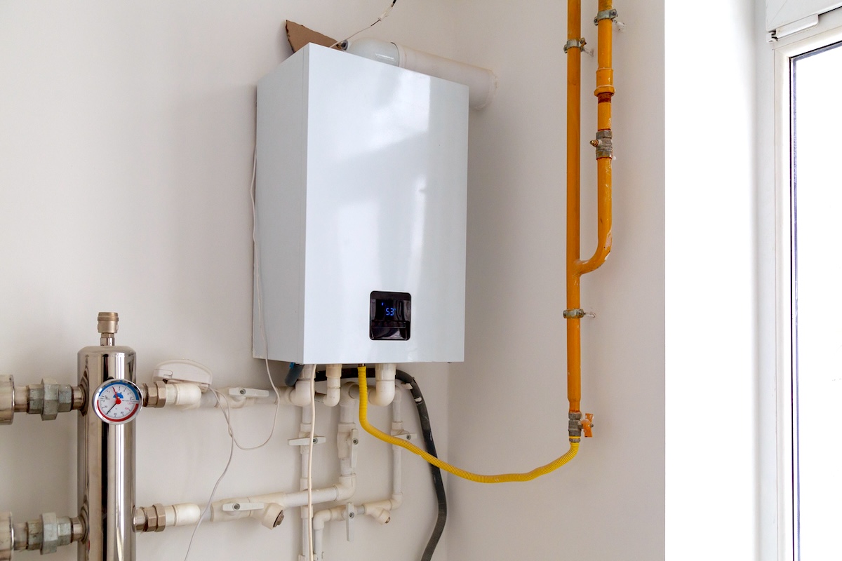 A residential gas boiler installed in a home basement.