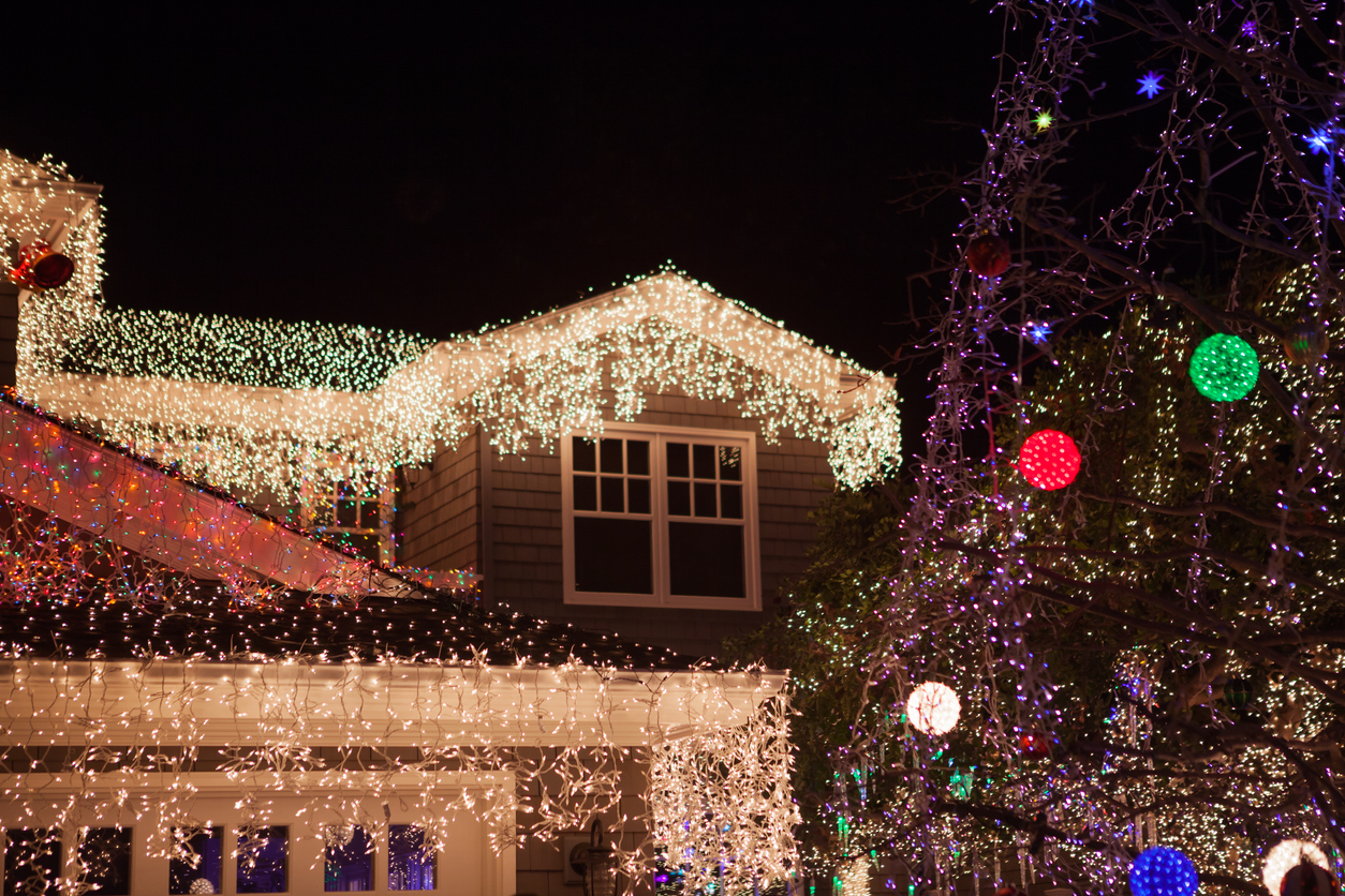 A residential home decked out with a lot of christmas lights.