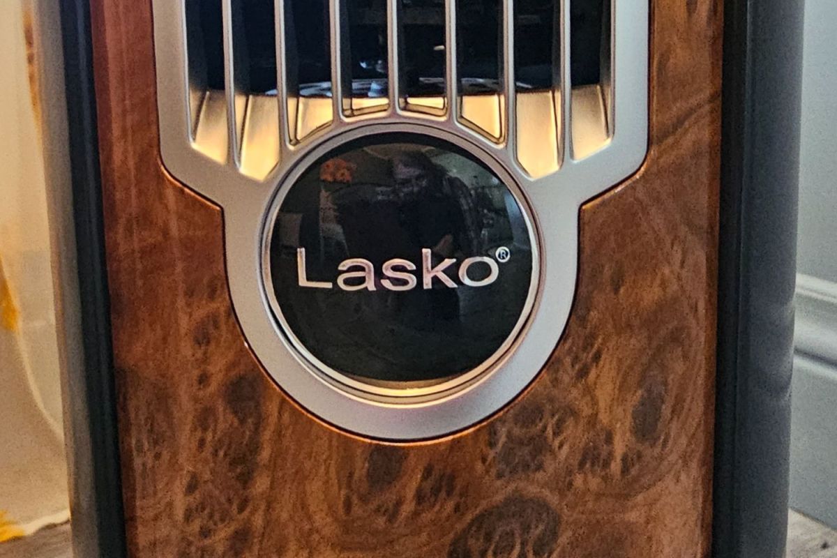 The Lakso logo embedded into the woodgrain panel on the front of the Lasko Wind Curve tower fan.