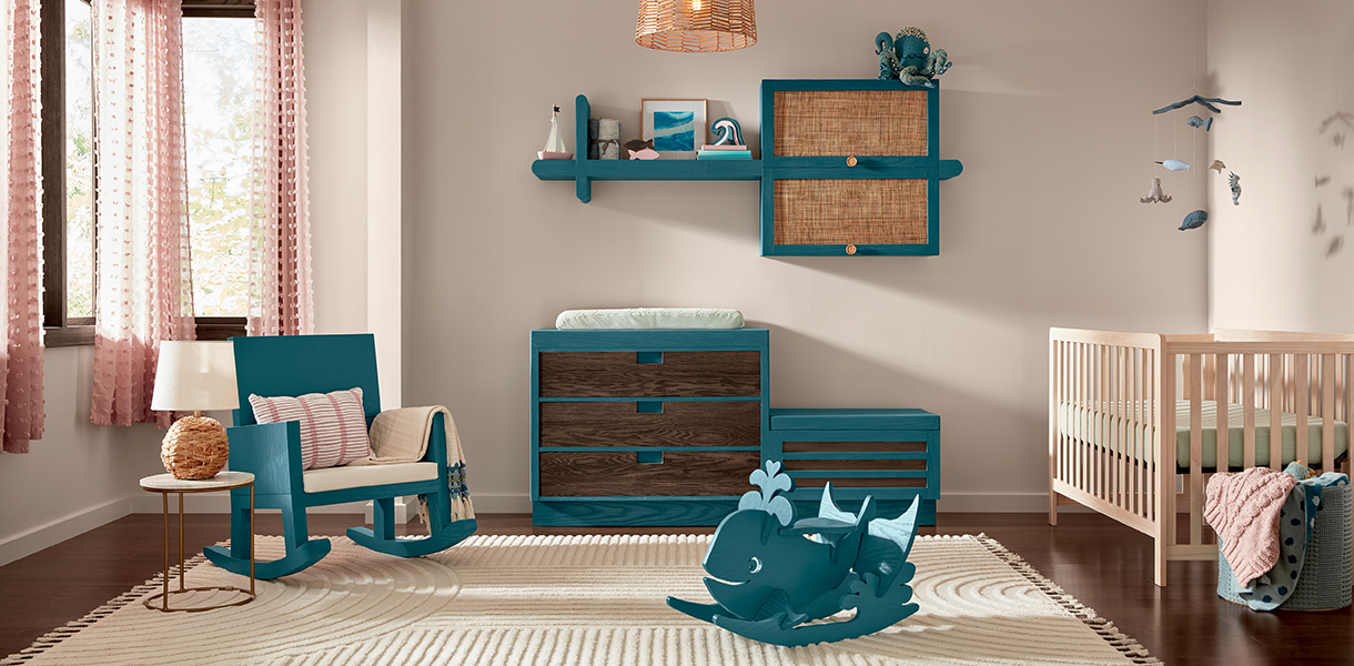 Child's nursery with white walls and a crib. toys, and shelf paint in Bay Blue.