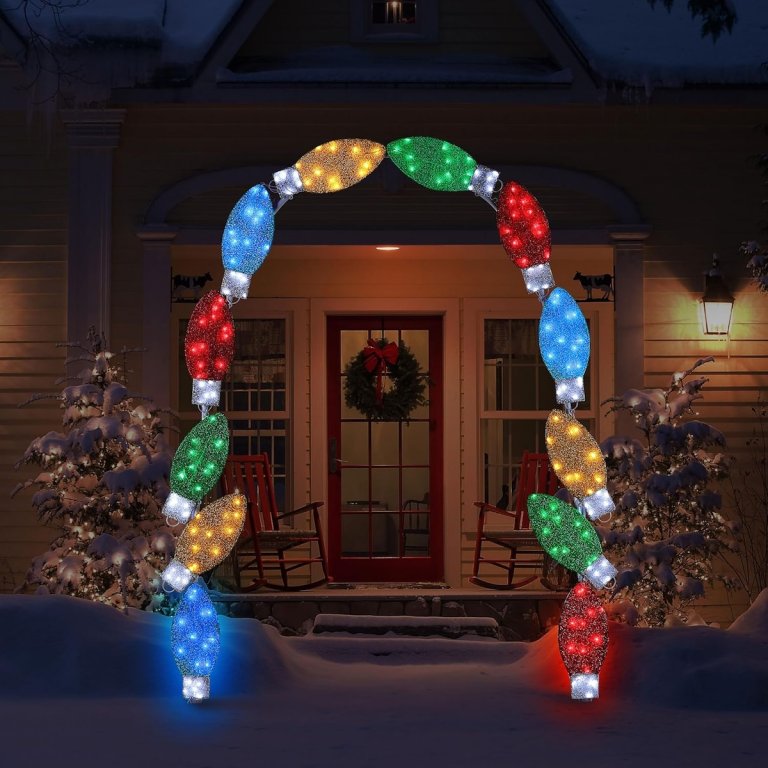 Mr. Christmas C9 bulb arch in front of a house in the dark.