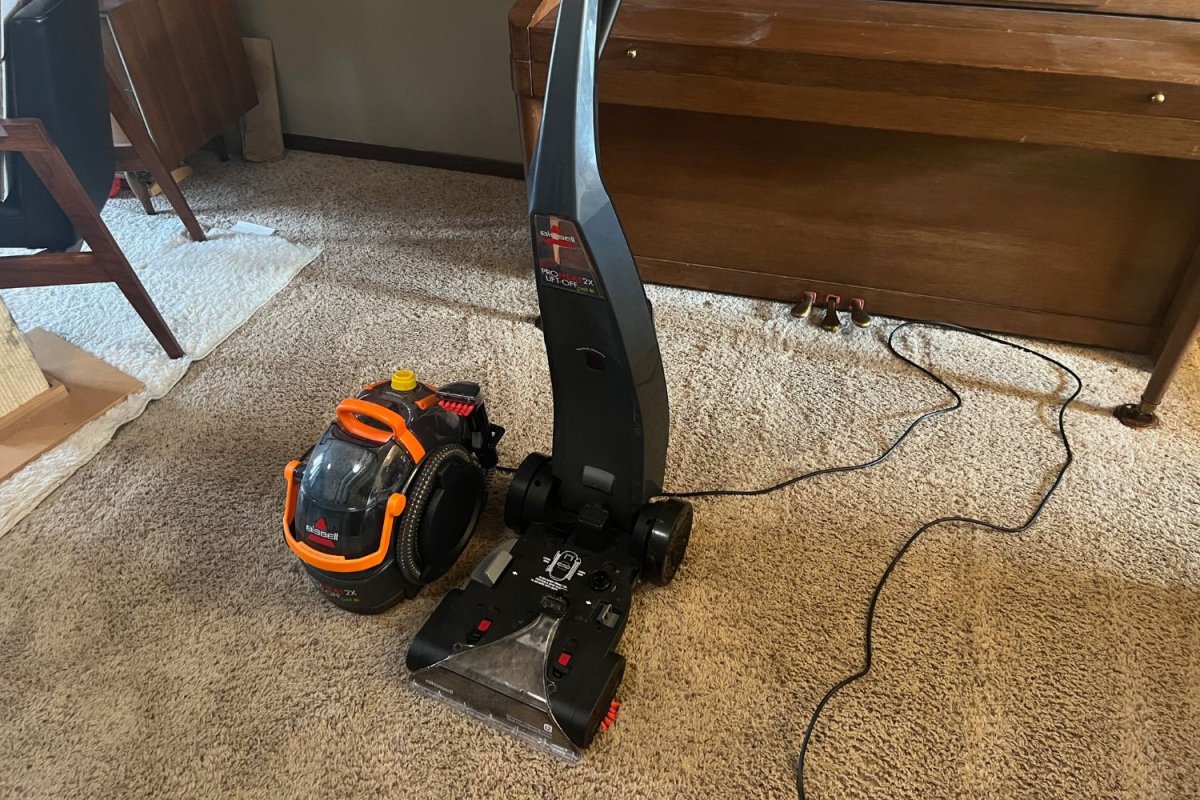 Gray and orange ProHeat 2X Lift-Off Pet Upright Carpet Cleaner on cleaned carpet