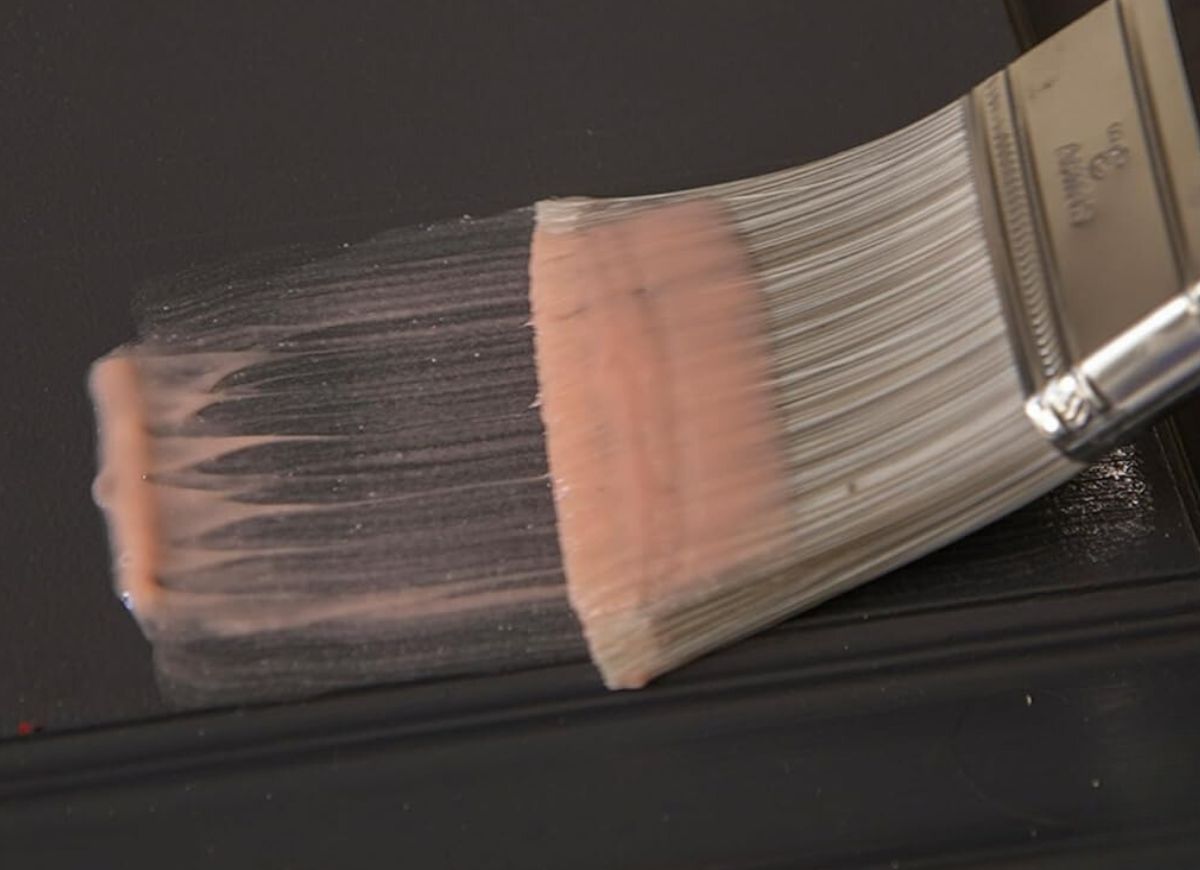 close up of paint brush using citrus paint remover