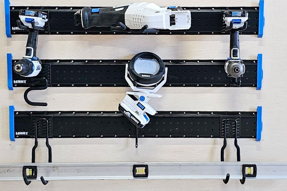 Several Hart Tools products hanging from a Hart Tools mountable storage system.