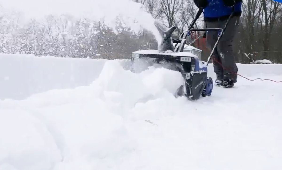 Snow Joe SJ627E electric snow blower being used on heavy snow