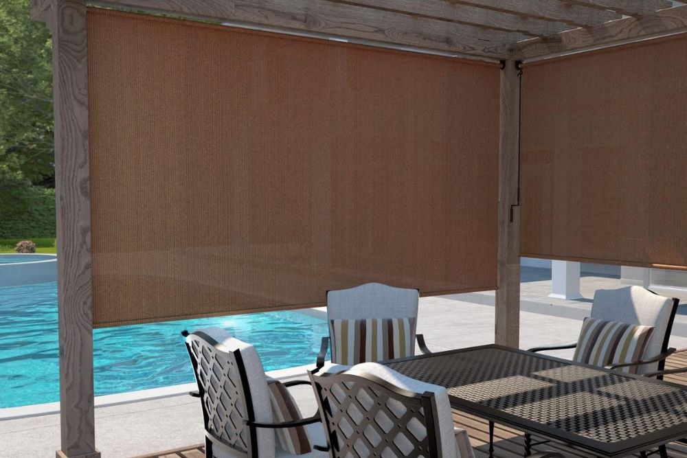 The Best Outdoor Shade installed between an outdoor patio table and swimming pool.