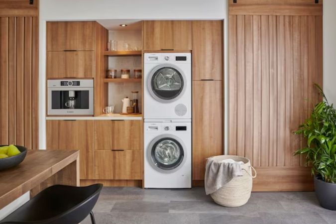 The best heat pump dryer installed in a wall of cabinetry in a modern living space.