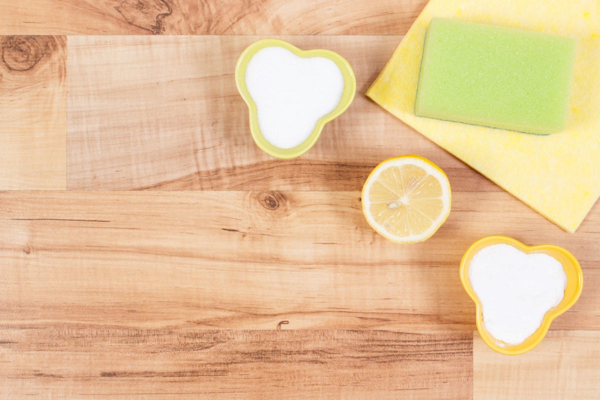 Small bowls of salt and slice of lemon on cutting board.