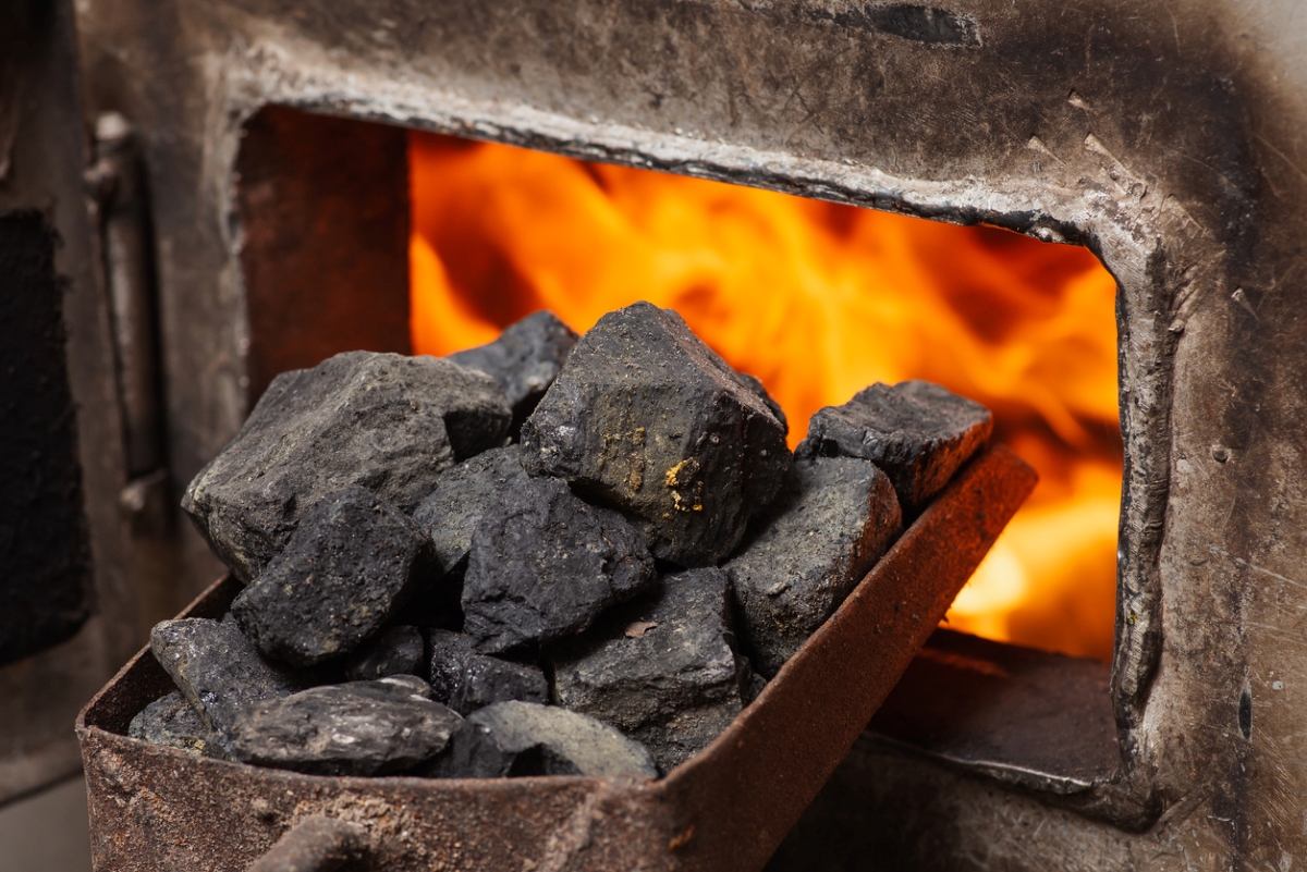 Charcoal going into fireplace.