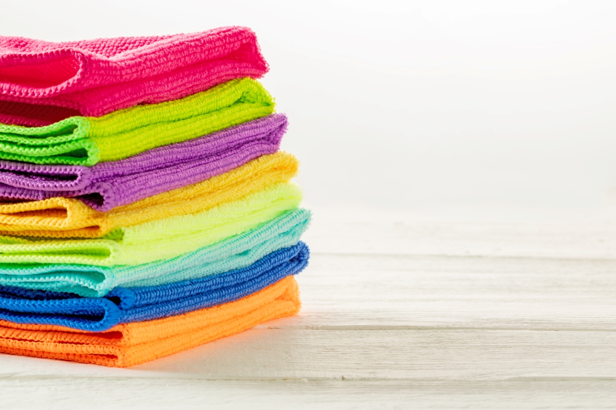 Stack of different colored microfiber towels.