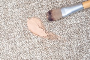 Dropped makeup brush and foundation on carpet.