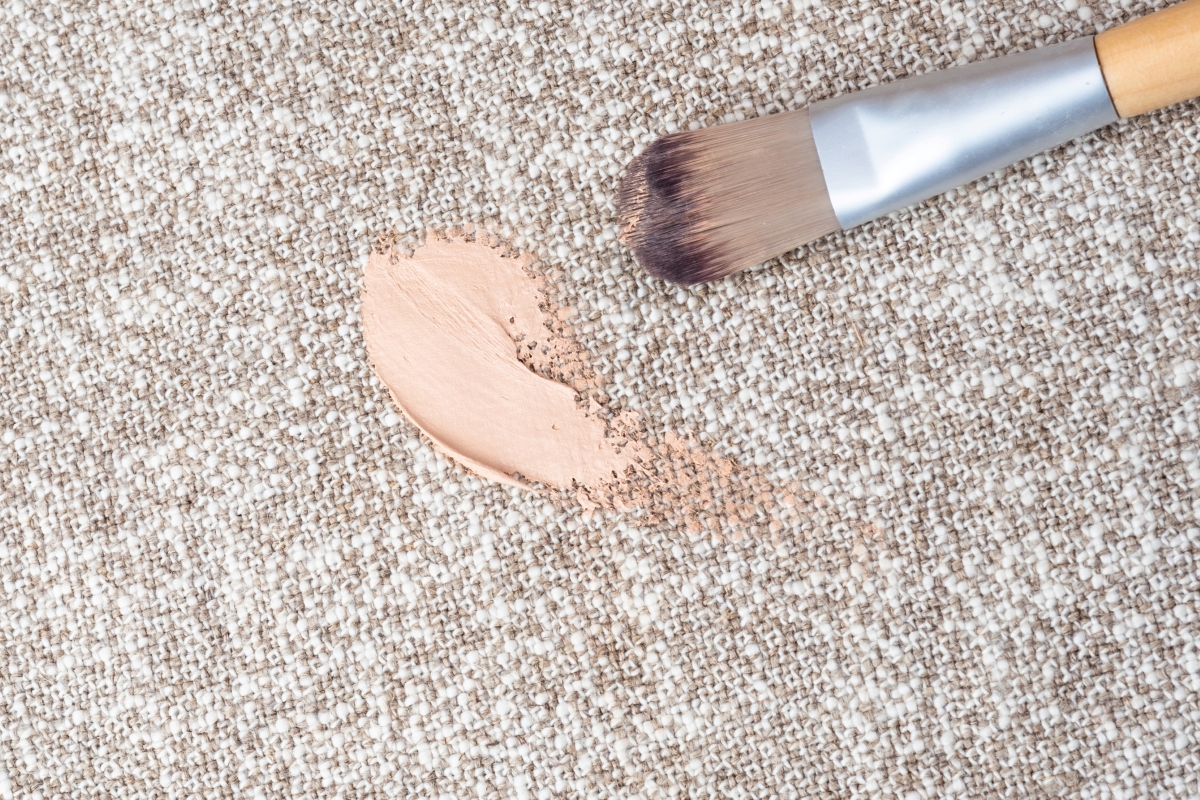 Dropped makeup brush and foundation on carpet.