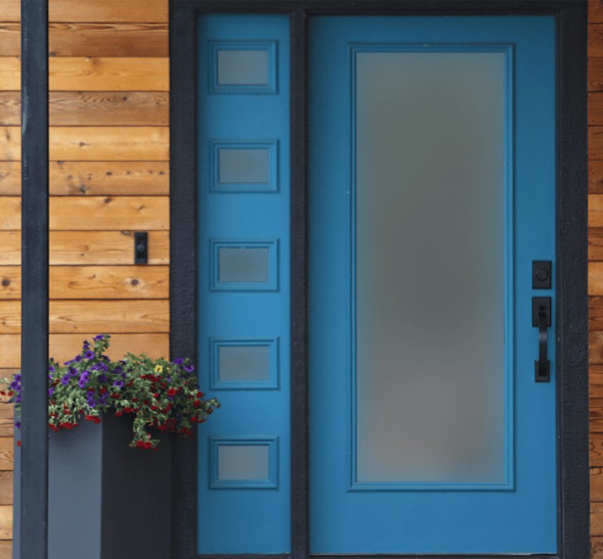 Modern blue front door with glass window and sidelights all with privacy film.