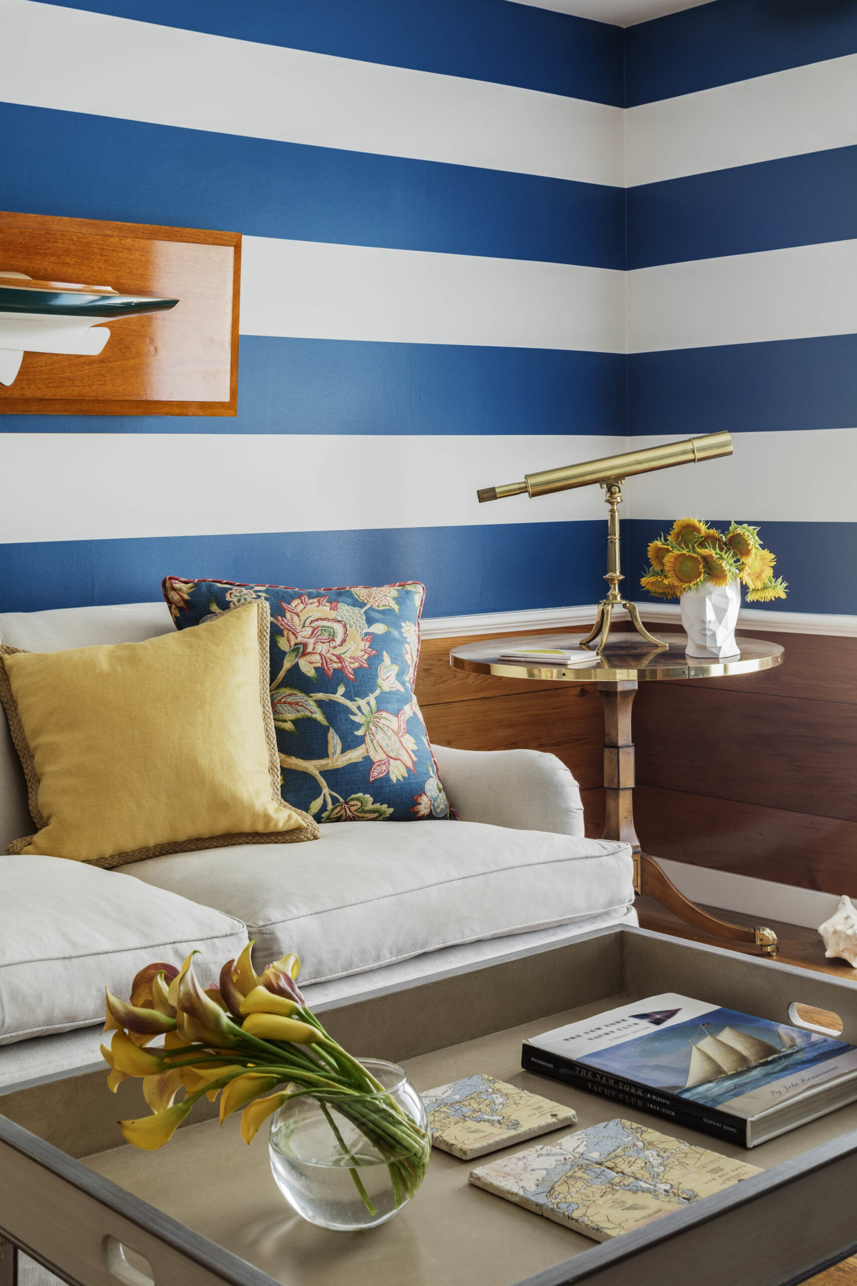 A-blue-and-white-stripe-wall-is-in-the-corner-of-a-living-area-scaled.