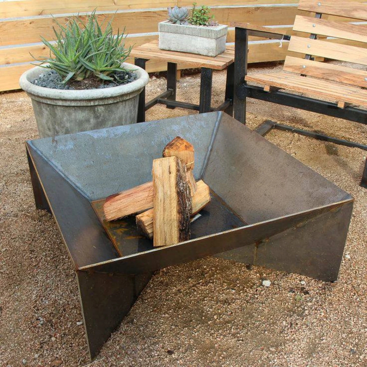 Metal fire pit with wood.