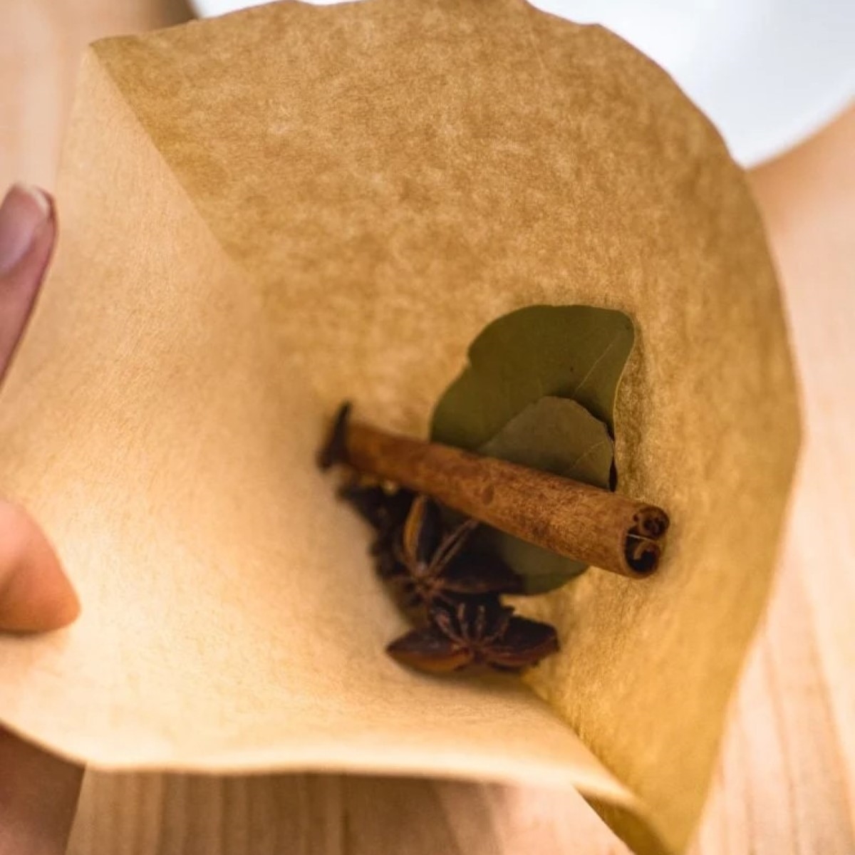 Soup spices in brown coffee filter.