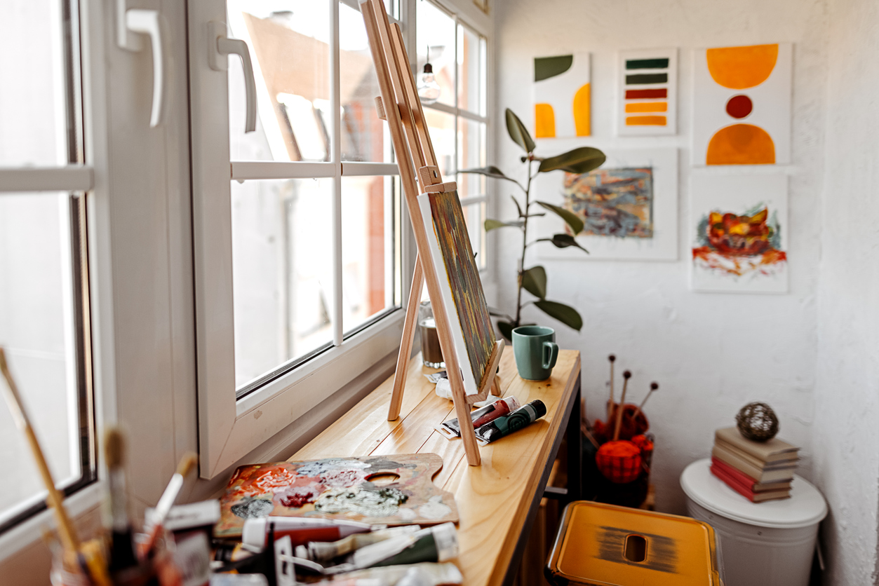 Cozy home art studio with colorful decoration and window.
