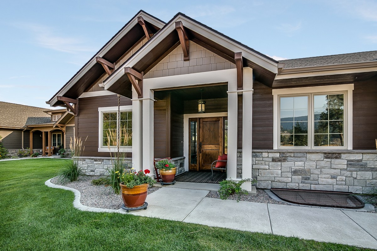 Home with stone features and front porch.