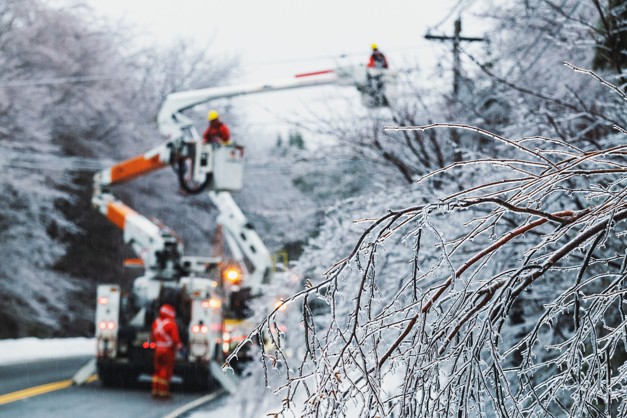 Workers-in-a-cherry-picker-restore-power-during-a-winter-ice-storm.