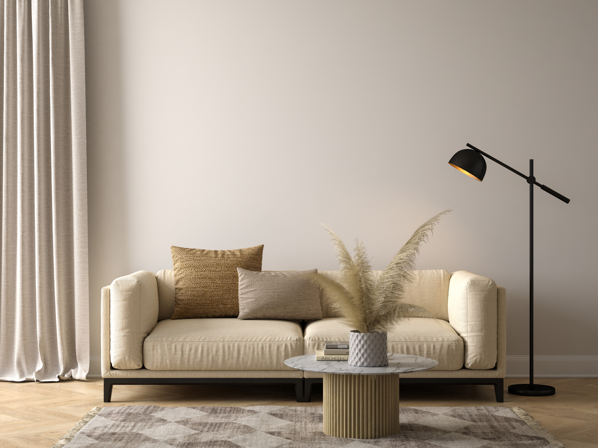 Beige living room with dark grey lamp.