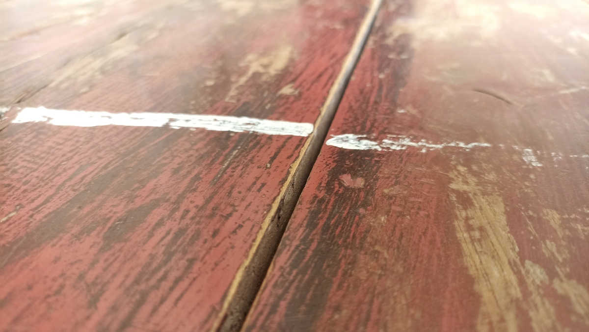 Dried white paint on wooden floors.