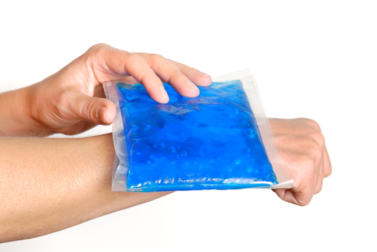 Blue ice pack on arm.