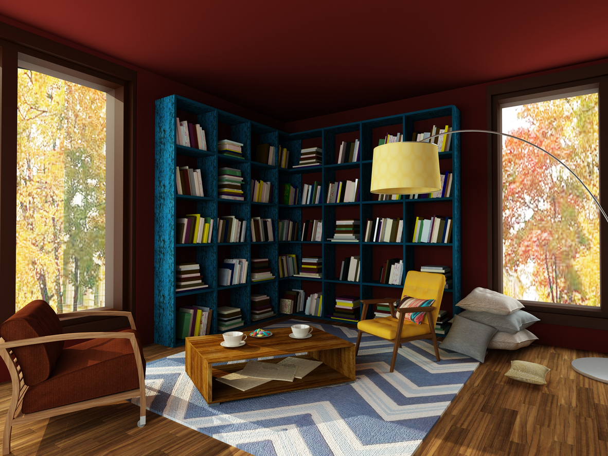 Home library with dark red ceiling color and blue bookshelf.
