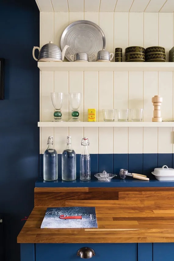 Blue wall with white accent shelf painted in Wimborne White by Farrow & Ball.