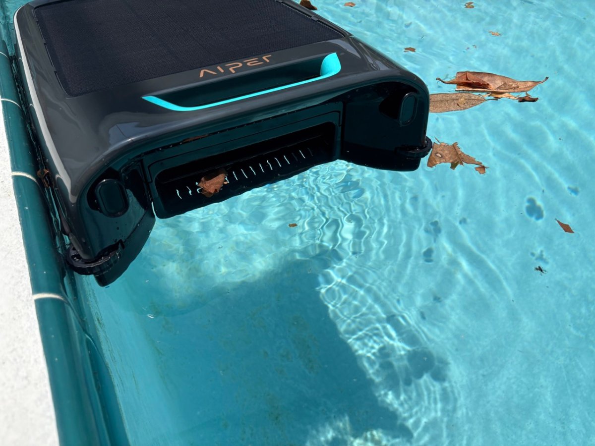 Robotic pool skimmer in use in pool Aiper Surfer