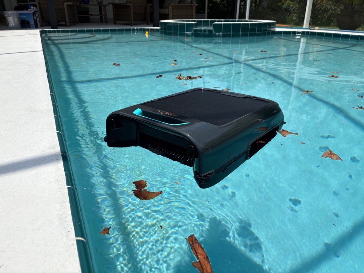 Robotic pool skimmer in use in pool Aiper Surfer