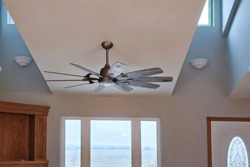 The rustic Barn by Minka-Aire ceiling fan installed on a ceiling for testing.
