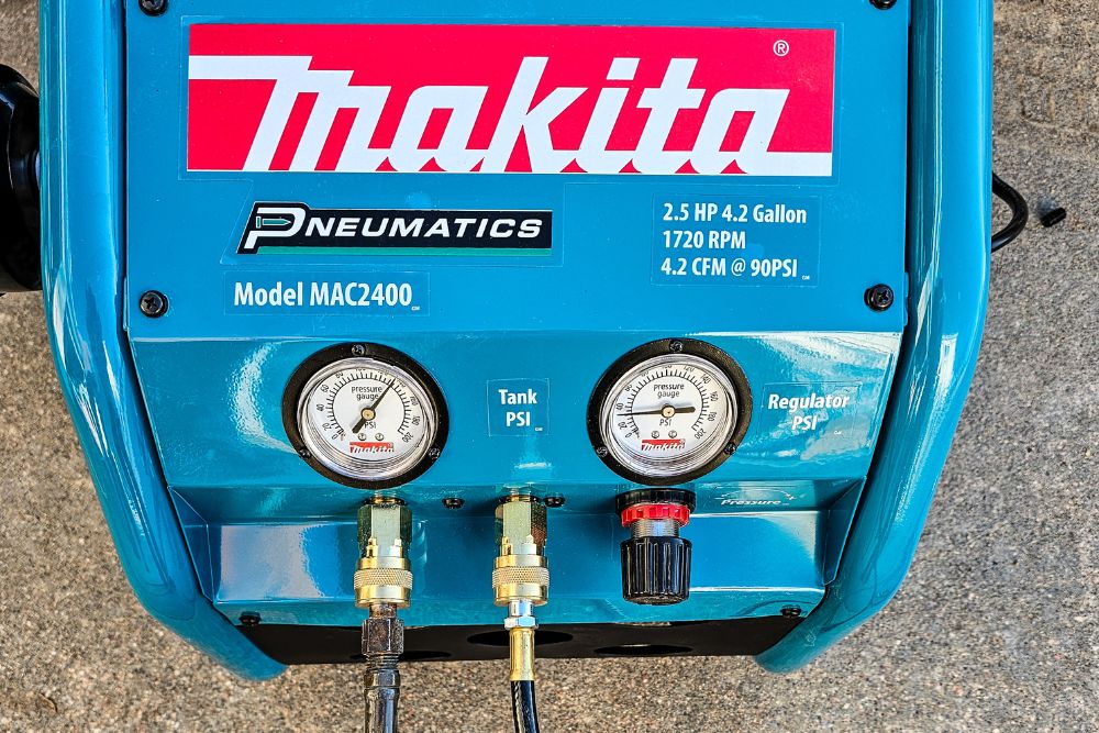 The hoses and gauges of the Makita MAC2400 air compressor during testing.
