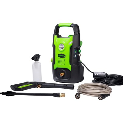 The Greenworks 1600 PSI 1.2 GPM Electric Pressure Washer along with its included nozzles, hoses, and detergent bottle on a white background.