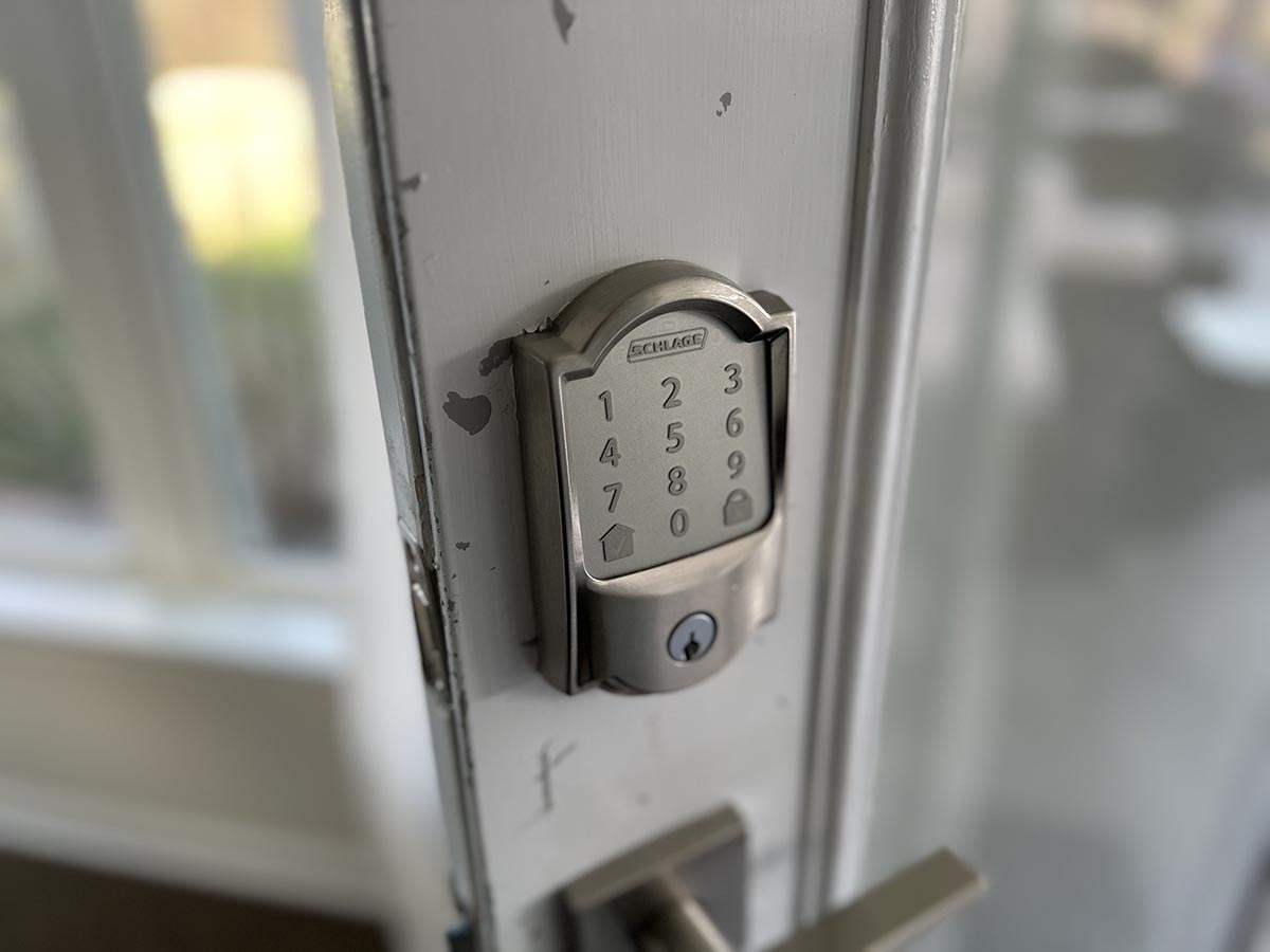 The Schlage Encode Smart Wi-Fi Deadbolt installed on a residential door for hands-on testing.
