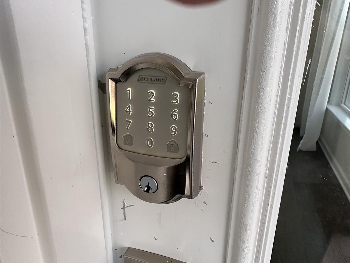 The Schlage Encode Smart Wi-Fi Deadbolt installed on a residential door for hands-on testing.