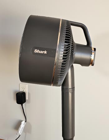 The Shark FlexBreeze Fan with InstaCool plugged into a wall during testing.