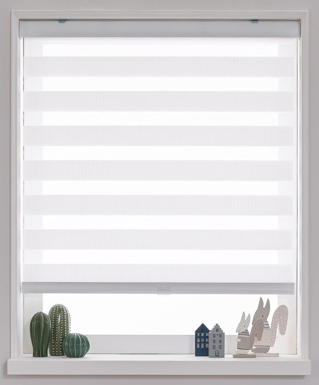 A set of roller blinds is pulled down to shade a white window.