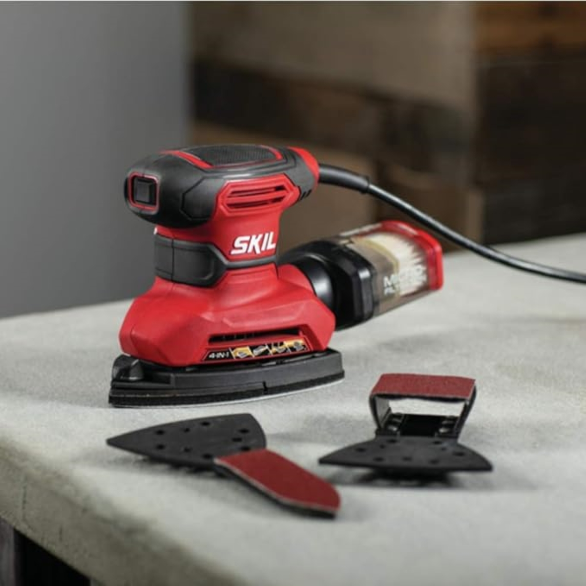 Red detail sander with pointed nose end.