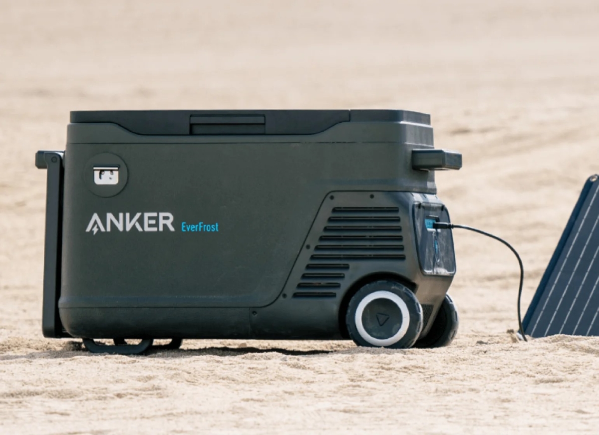 Battery powered cooler in sand.