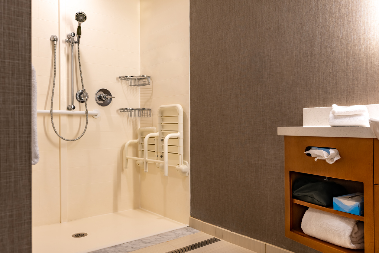 Wheelchair accessible bathroom and shower with safeguards.