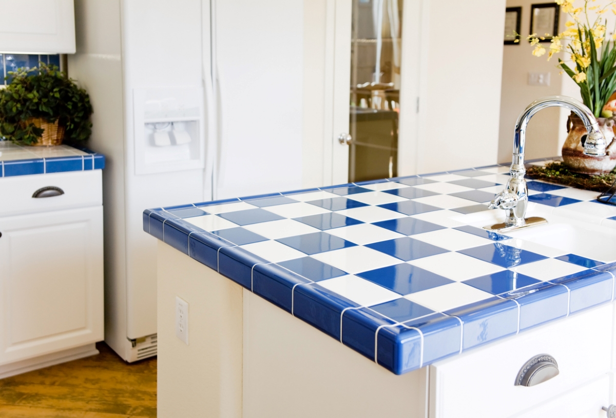 Checkered white and blue kitchen countertop.