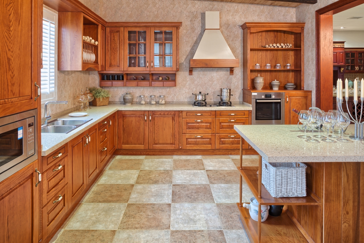 Tuscan style kitchen with tile backsplash and floor.