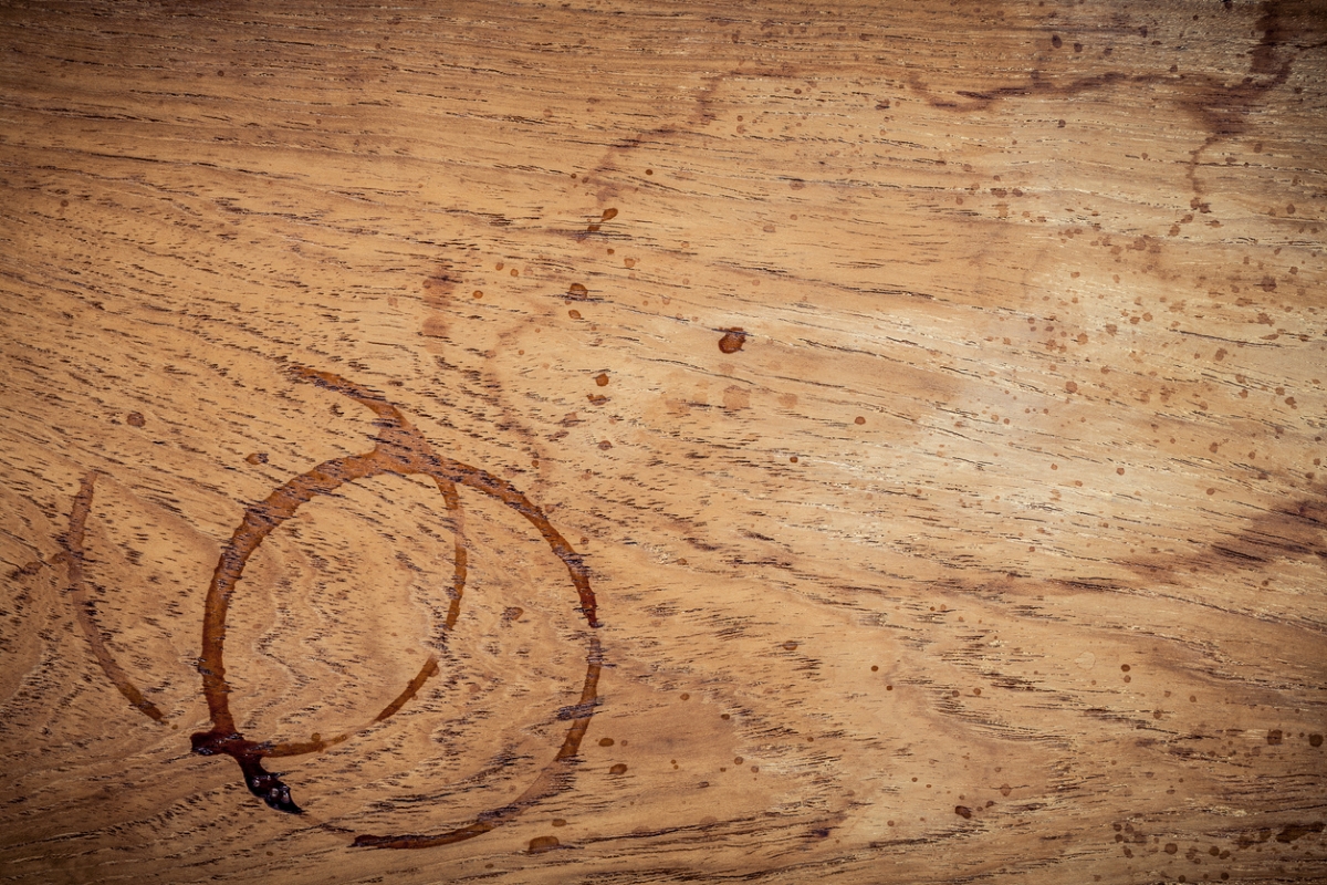 Two water ring stains on wooden table.