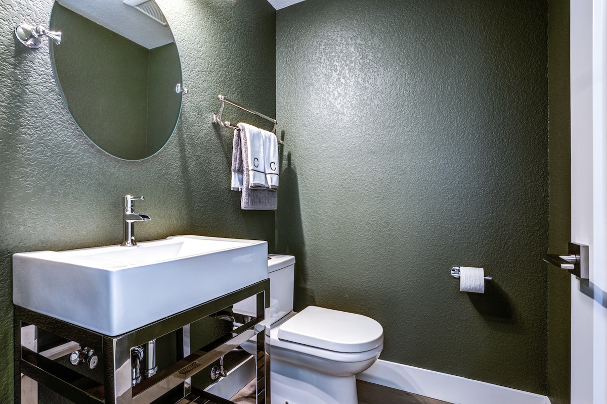 A small half bathroom or powder room in a residential home.