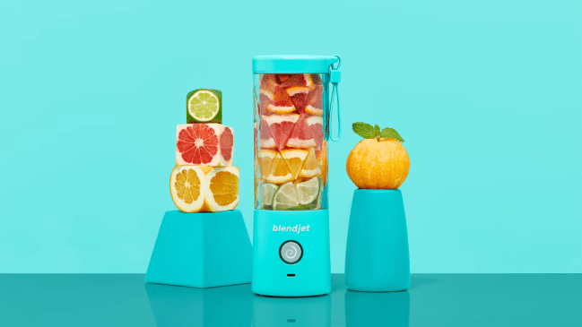 A BlendJet2 Blender is filled with citrus fruits.