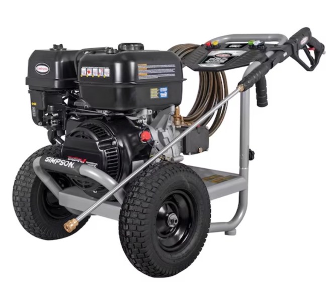 A pressure washer with hose stored on the side sits against a white background.