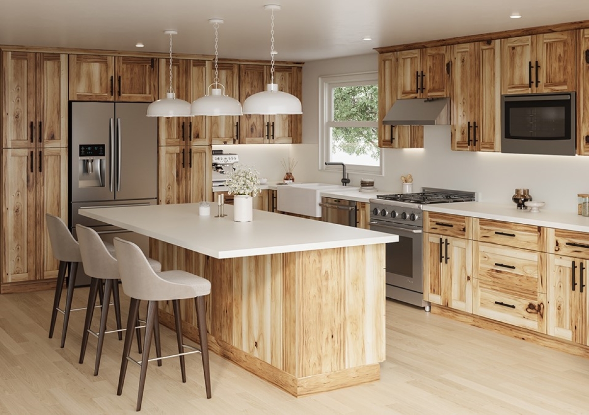 Kitchen with island and natural wood cabinets.