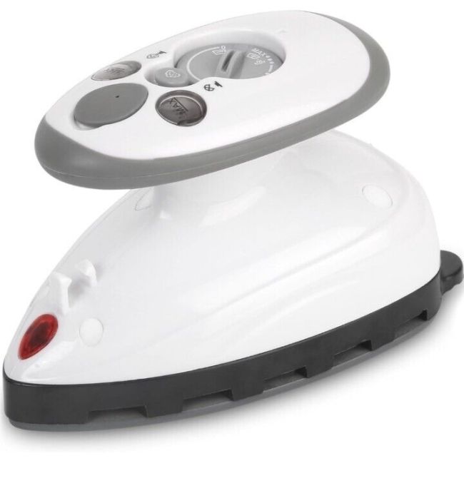 A white handheld steam iron is sitting on a white background.