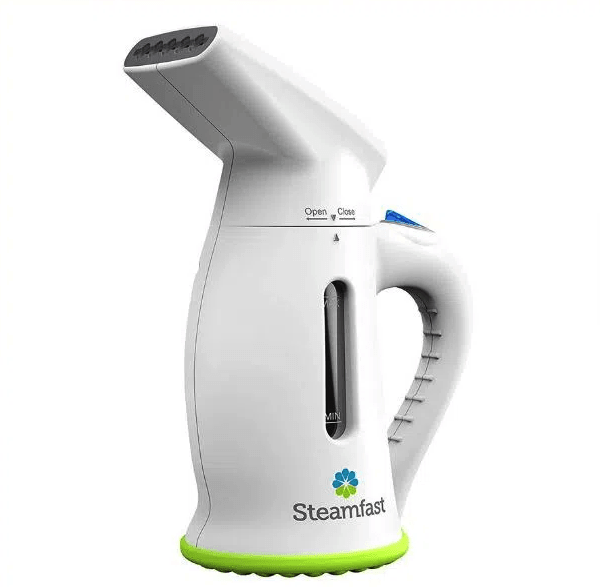A handheld steamer is white with green accents.