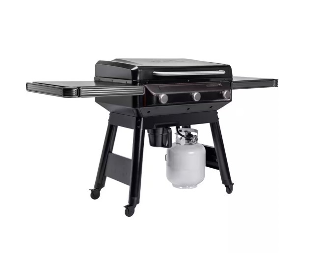 A black flat top grill holds a propane tank underneath.